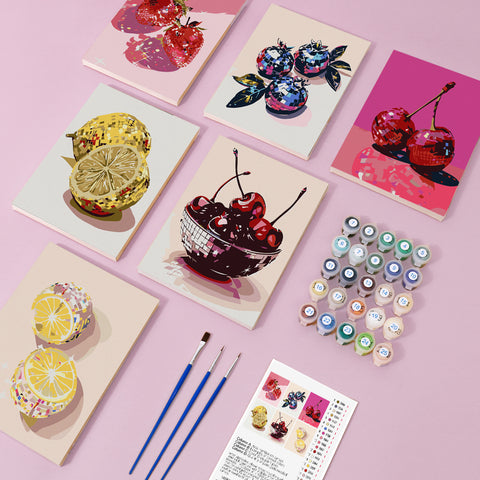 Six mini paint by numbers canvases arranged in a set, each featuring a stylized fruit bowl illustration including cherries, blueberries, strawberries, lemons, and citrus arrangements. Each artwork uses a bold graphic illustration style with pixel-like color blocks, simplified geometric shapes, and decorative fruit compositions.