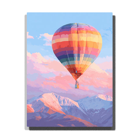 Rainbow hot air balloon floating above snowy mountain peaks with colorful patchwork panels, pink clouds, pale blue sky, and lavender mountain shadows, paint by numbers wall art by PaintEasy