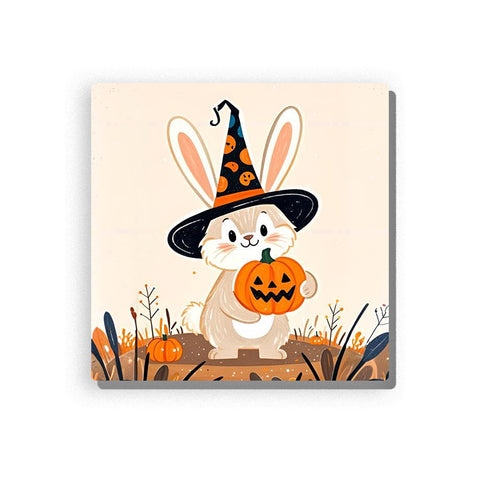 Halloween bunny wearing a black witch hat with orange pumpkin patterns, holding a jack-o’-lantern bucket, with long cream ears, rosy cheeks, small pumpkins, autumn grasses, and soft beige background, Paint by Numbers kit for kids by PaintEasy.