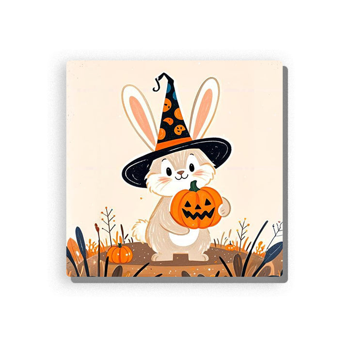 Halloween bunny wearing a black witch hat with orange pumpkin patterns, holding a jack-o’-lantern bucket, with long cream ears, rosy cheeks, small pumpkins, autumn grasses, and soft beige background, Paint by Numbers kit for kids by PaintEasy.
