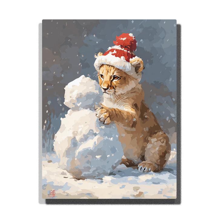 Lion cub wearing a red Santa hat building a snowman with golden-brown fur, falling snow, white snow shapes, and gray-blue winter background, paint by numbers wall art by PaintEasy