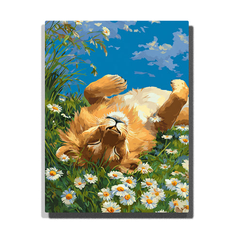 Golden lion cub rolling on its back among white daisies with raised paws, fluffy fur, green meadow grass, blue sky, and sunny clouds, paint by numbers wall art by PaintEasy