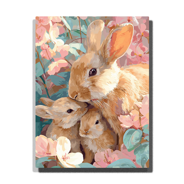 paint by numbers artwork depicting rabbit mother and two baby rabbits surrounded by pastel flowers and soft leaves, animal wall decor for adults by PaintEasy