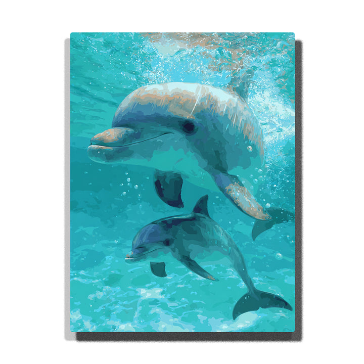 paint by numbers artwork depicting dolphin mother and baby swimming underwater with blue water, light rays and bubbles, ocean animal wall decor for adults by PaintEasy