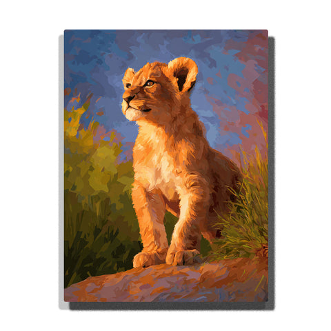 Lion cub sitting on a warm rock in evening grass with golden-orange fur, cream chest, alert eyes, blue-purple sky, and sunset highlights, paint by numbers wall art by PaintEasy