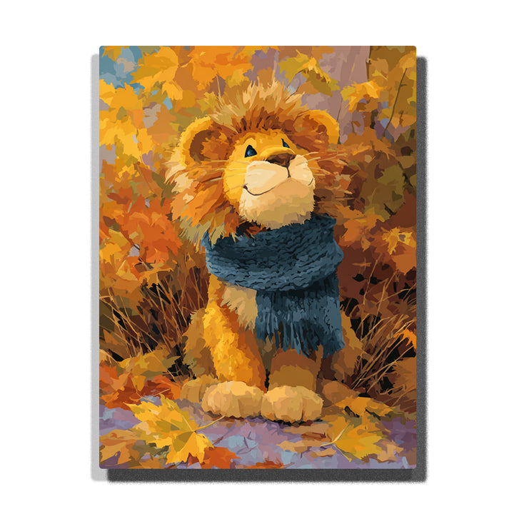 Lion cub in a blue scarf sitting among golden autumn leaves with fluffy mane, warm orange foliage, rounded paws, and cozy seasonal mood, paint by numbers wall art by PaintEasy