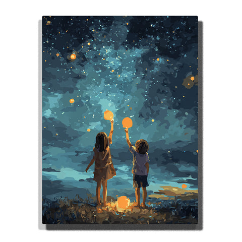 Two children holding glowing lanterns under a starry teal night sky with floating lights, grassy shoreline, dark clouds, and warm golden glow, paint by numbers wall art by PaintEasy