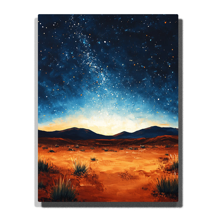 A starry desert landscape with warm sandy ground, dark distant hills, sparse shrubs, and a glowing blue night sky in this PaintEasy Paint by Numbers artwork.