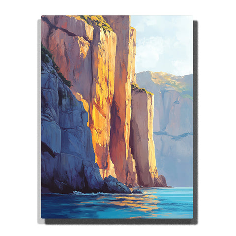 Sunlit coastal cliffs rising above clear blue water with warm rock faces and soft sea reflections, landscape paint by numbers wall art by PaintEasy