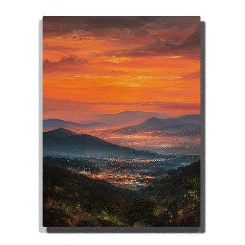 Glowing valley lights beneath a burnt orange sunset sky with layered blue mountains and dark foreground slopes, landscape paint by numbers wall art by PaintEasy