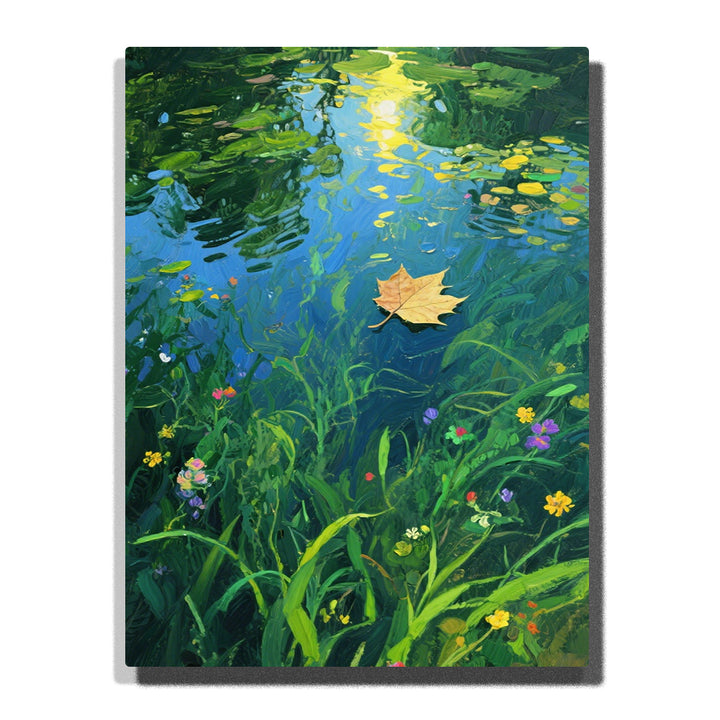 Paint by numbers kit featuring floating autumn leaf on serene water with wildflowers and reflection
