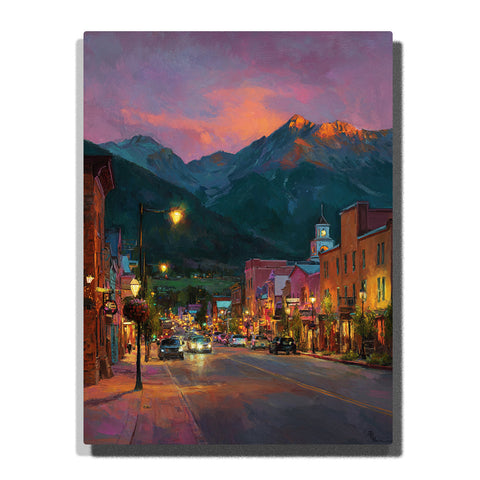 Mountain town main street with glowing shop lights, cars, clock tower, and dusky peaks beneath a lavender orange sky, city paint by numbers wall art by PaintEasy