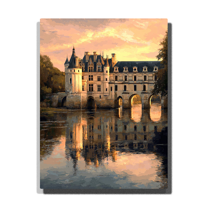 Château bridge reflections beneath a soft gold evening sky with arched stone structure, calm river mirror, and elegant historic city architecture, city paint by numbers wall art by PaintEasy