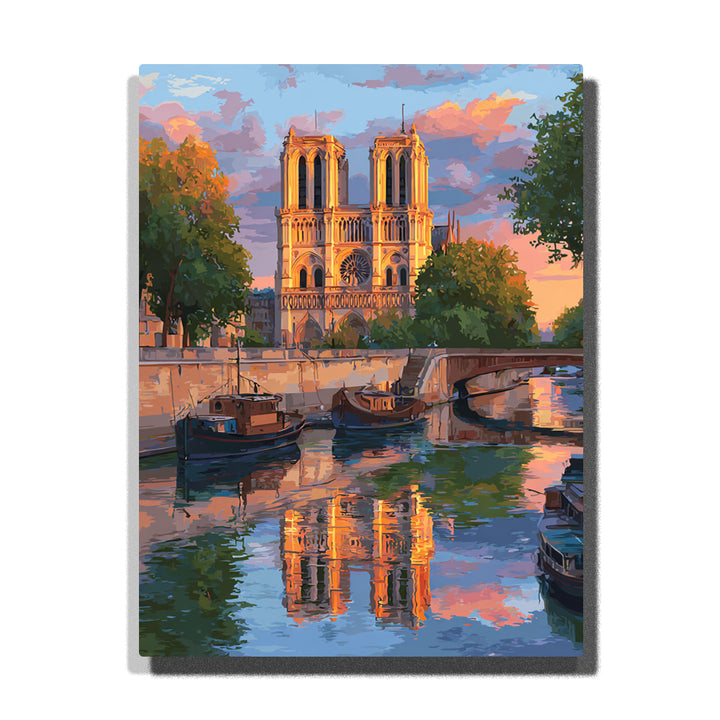 Notre-Dame towers above a reflective riverside canal with moored boats, arched bridge, pastel evening sky, and glowing Paris city light, city paint by numbers wall art by PaintEasy