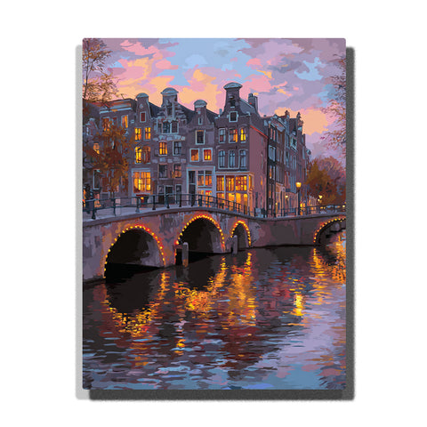 Glowing canal bridge arches beneath a lavender evening sky with lit windows, historic waterfront houses, and shimmering city water reflections, city paint by numbers wall art by PaintEasy