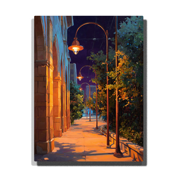 Lamplit city sidewalk with vintage streetlights, warm brick building, leafy trees, deep blue night sky, and golden shadows paint by numbers wall art.