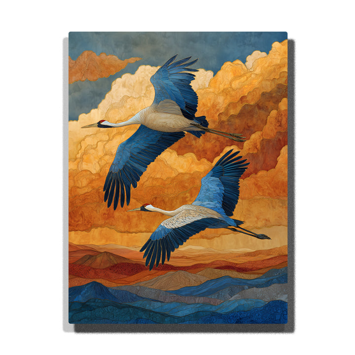 Two flying cranes with blue wings over layered golden clouds, rolling mountain bands, orange sky, and decorative wildlife paint by numbers wall art.
