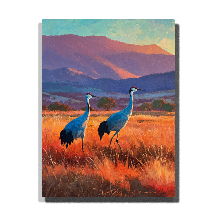 Two blue-gray cranes standing in golden grass meadow with purple mountain layers, turquoise sky, red crown accents, and wildlife paint by numbers wall art.