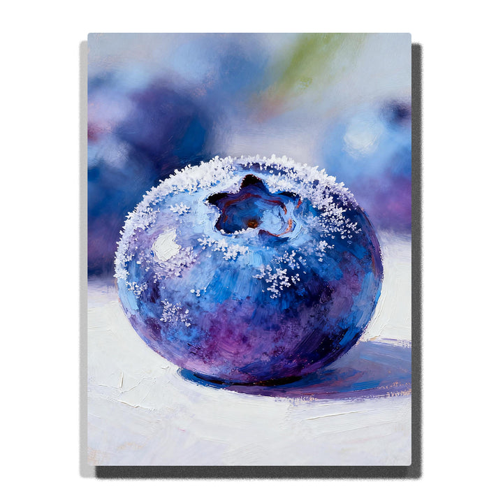 Close-up frosted blueberry on a white tabletop, featuring deep blue and violet tones, pale frost texture, glossy highlights, and a soft blurred background.