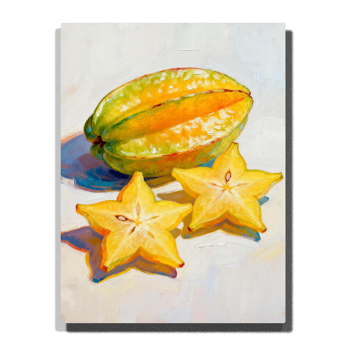 Yellow starfruit with two sliced star-shaped pieces on a white tabletop, featuring glossy green-yellow skin, orange ridges, seed details, and soft shadows.
