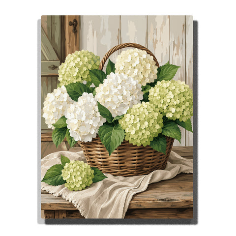 White and green hydrangea flowers in woven basket on rustic wooden table with green leaves and farmhouse interior background Paint by Numbers by PaintEasy