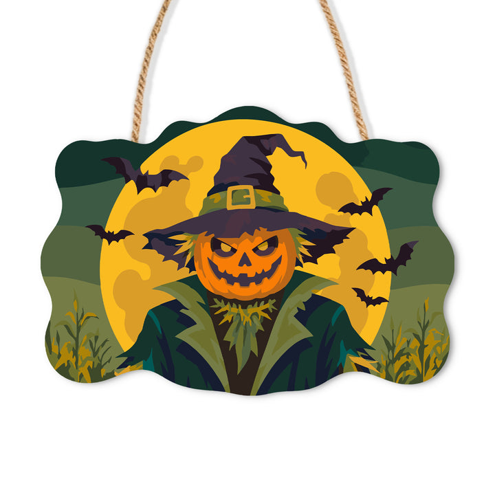 Pumpkin-headed scarecrow in a broad hat against a golden moon and bats