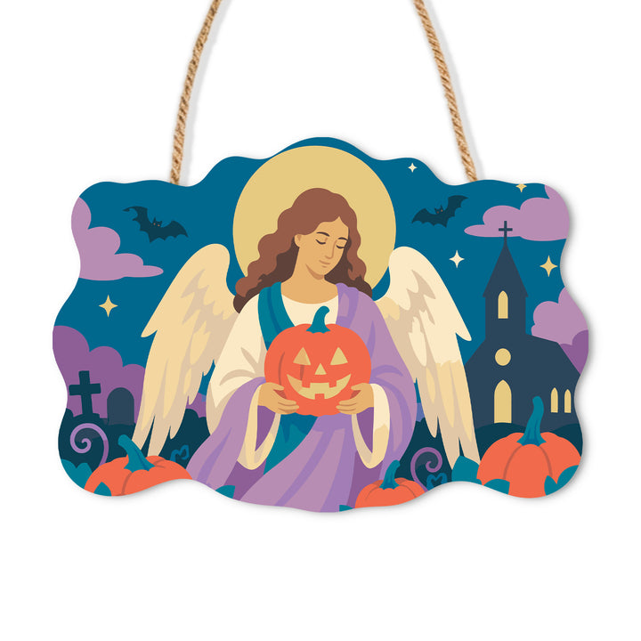 Angel holding a jack-o-lantern beside a nighttime church on a wooden sign