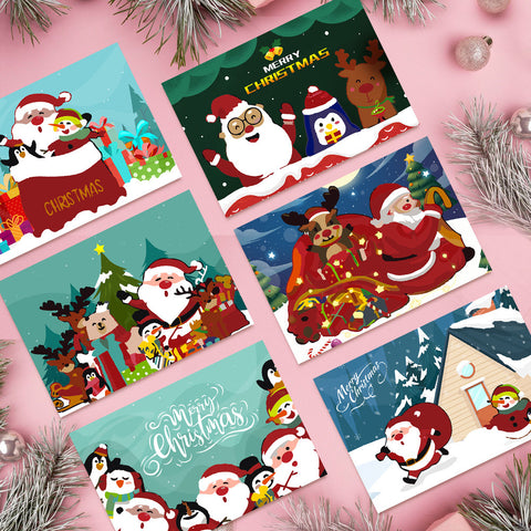 Six Christmas greeting card paint by numbers designs arranged as a festive set, featuring Santa Claus, reindeer, penguins, snowmen, Christmas trees, and holiday gift scenes. Each card uses a clean flat illustration style with bright colors, simple shapes, and cheerful Christmas-themed characters.