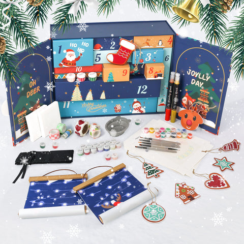 Christmas craft surprise box paint by numbers kit featuring blue themed holiday designs including Santa Claus, reindeer, stockings, snowflakes, JOYFUL DAY typography, Christmas ornaments, paints, brushes, stickers, and DIY craft materials arranged as a festive seasonal craft set.