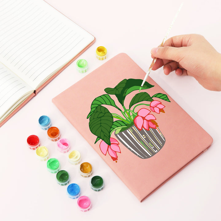 Pink flowering houseplant with green leaves and striped pot Notebook Paint by Numbers Kit with yellow and pink cover options by PaintEasy