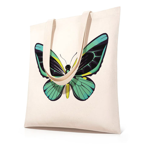 DIY butterfly paint by numbers tote bag kit featuring a canvas shopping bag with a large symmetrical butterfly illustration in green, teal, black, and yellow tones, shown as a before-and-after style transformation from outline sketch to fully colored wing design.