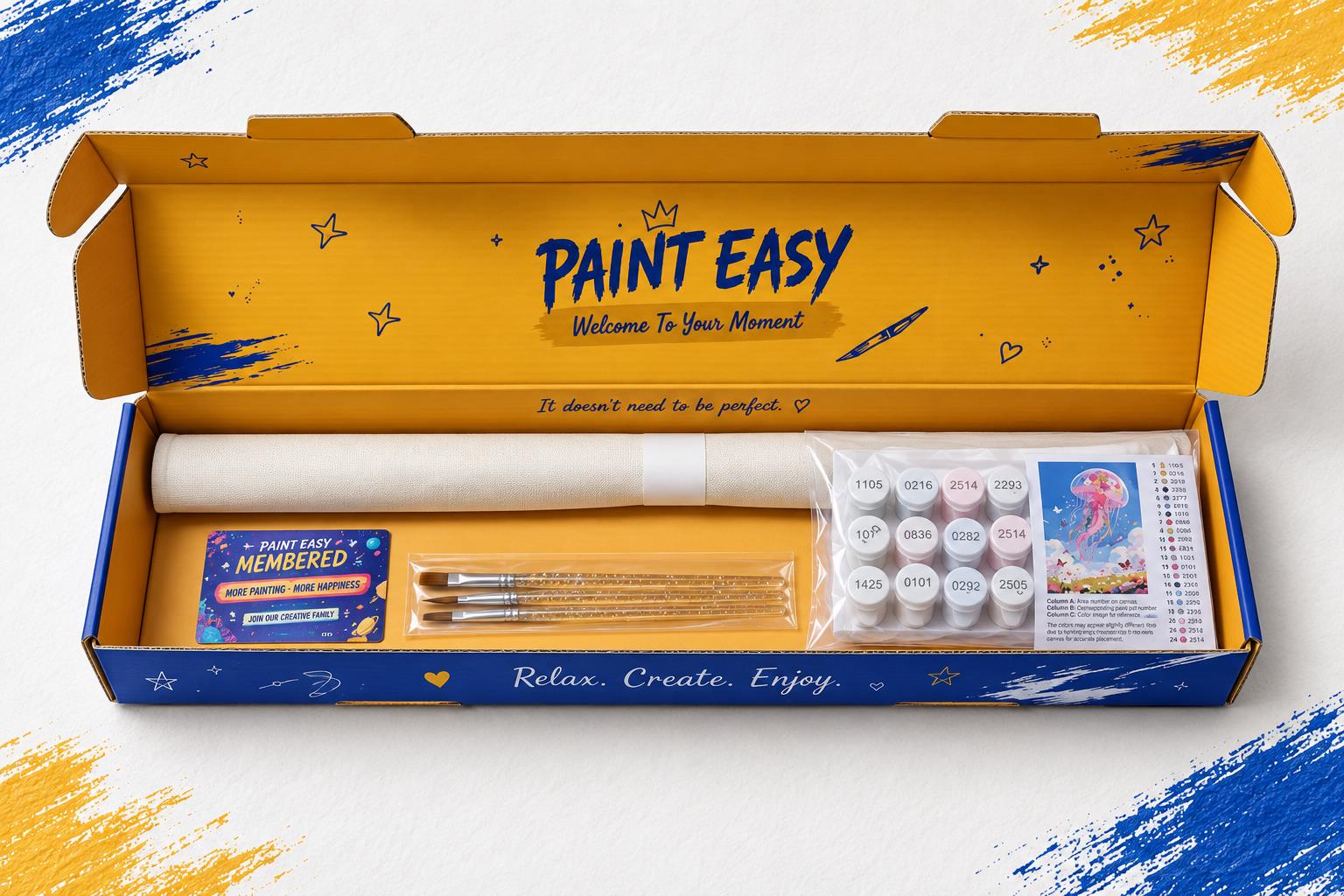 Open PaintEasy blue and golden-yellow box containing a rolled unframed canvas, brushes, paints and reference sheet